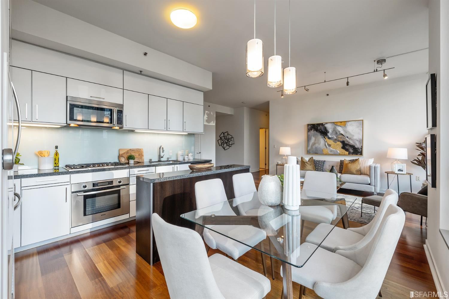 Open concept kitchen, dining and living areas.