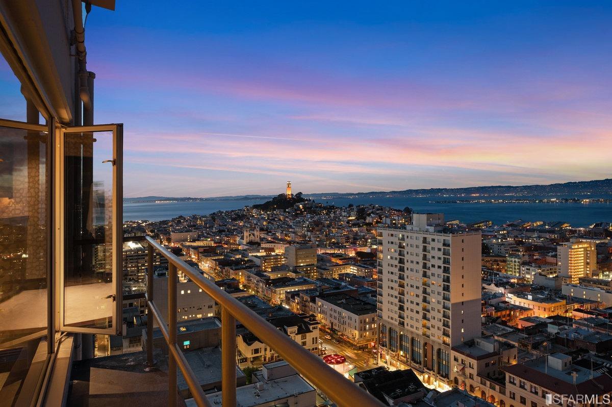 This two-level Nob Hill penthouse offers sweeping views - stretching from the Golden Gate Bridge to the Bay Bridge - from each of two bedrooms, a corner terrace, and the entire expanse of its living and dining spaces. An uncompromising, down-to-the-studs renovation in 2005 achieved the height of elegance, a dream for entertaining and a delight for quiet relaxation. The open floor plan highlights numerous points of interest - painstaking wall treatments, fireplaces, an elegant bar - while allowing one to enjoy a continuous band of windows running the length of the unit. No expense was spared with the materials and finishes, including quarter sawn oak floors, massive slabs of richly veined marble, intricate wood veneers, and silver-leaf ceilings. Lutron lighting, concealed shades, and a state-of-the-art AV system dial-in the perfect ambiance. Outfitted with the finest appliances, the kitchen will delight the most discerning chef. Enter the unit directly from the key-controlled elevator.