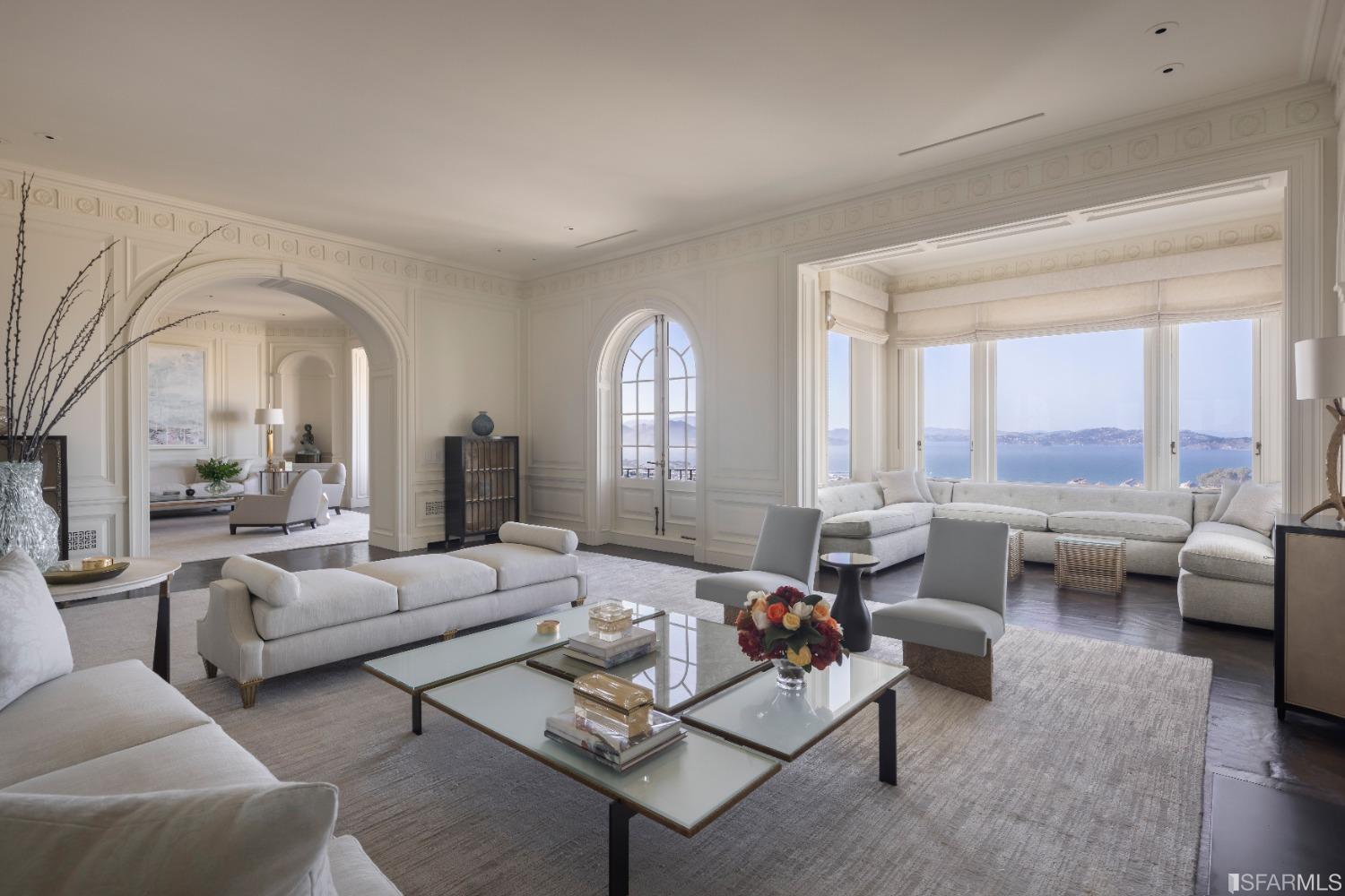 ***Now Reduced $5,000,000*** One of only two pre-war duplex penthouses in Pacific Heights, #7 at 2000 Washington boasts a striking panorama of the San Francisco Bay, from Golden Gate to Alcatraz to Russian Hill.    Designed by architect Andrew Skurman, whose design for the Penthouse received the Julia Morgan Award from the Institute of Classical Architecture & Arts, the residence is distinguished by a sweeping suite of grand yet elegant entertaining rooms from entrance gallery to living room, family room, expansive kitchen & formal dining room. White fluted pilasters, rosettes, high ceilings, and arches in enfilade make a definitively classical statement, yet convey a modern feeling of openness.    An opulent primary suite complements three guest bedrooms, each with luxurious marble baths. A curvilinear staircase ascends to the upper-level at-home office or media room with soaring ceilings, a wet bar, powder bath, fitness room and large, landscaped North Bay view terrace.    Advanced smart-home infrastructure includes Savant technology as well as air-conditioning. Residents enjoy two-car parking, an attended lobby, and professional residential management.