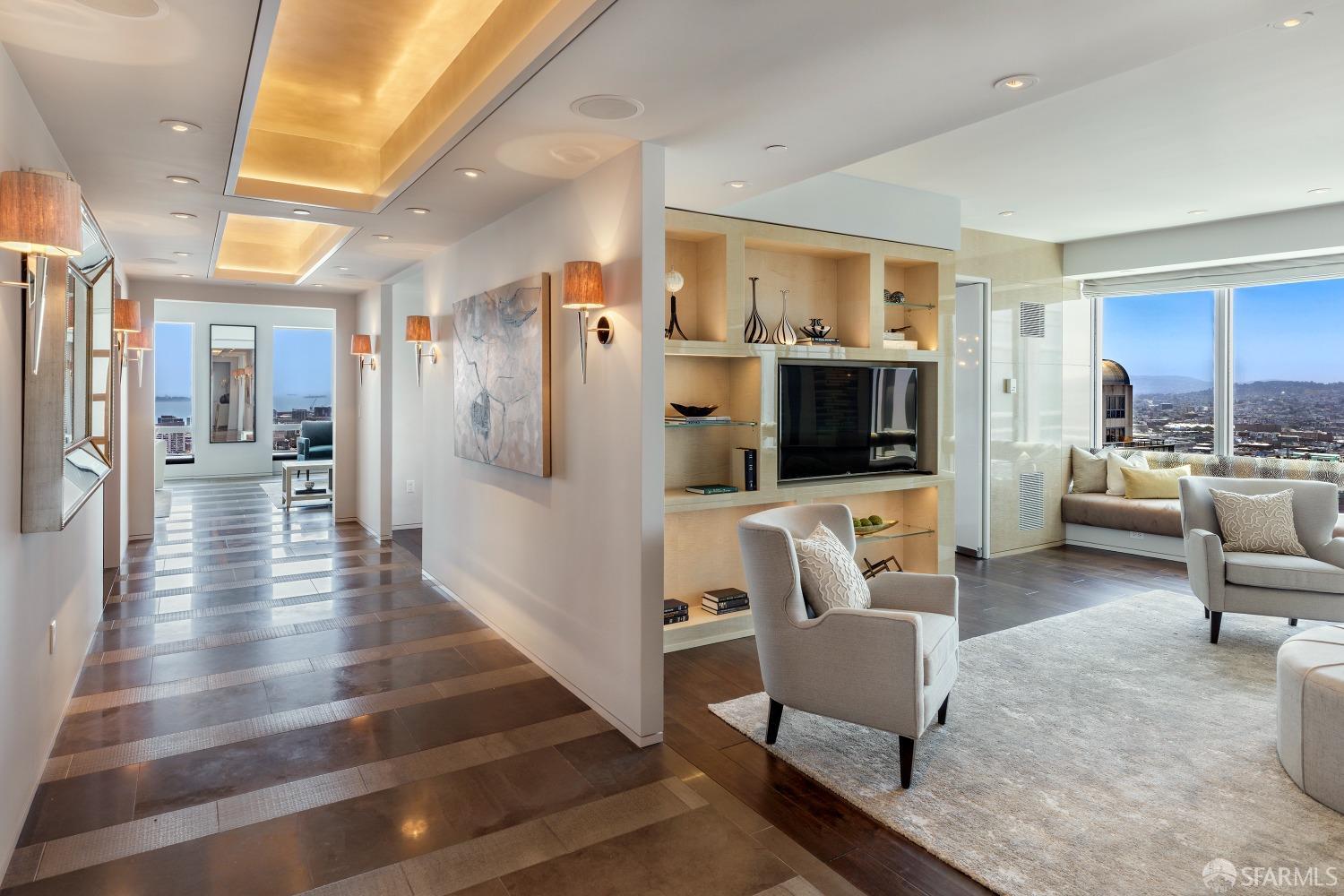 Just Reduced $2,900,000! Commandingly sited high in the iconic Four Seasons Hotel, this triple-mint 4BD, 4,550sf major view condominium boasts a large living room, open kitchen & family room, paneled office & view dining room. Oversized windows on three sides deliver captivating views of the sunrise over the San Francisco Bay, the dynamic Downtown skyline & sunset views toward City Hall & Twin Peaks. Extensively renovated by designer Jacques Saint Dizier & Muratore Construction, the substantial layout & elegantly proportioned rooms enable daily living & sophisticated entertaining. Advanced infrastructure includes Lutron lighting & shading and media/entertainment systems. Move-Right-In! Four Seasons #34A is the largest constructed condominium listed for sale downtown. 5-Star Four Seasons Hotel & Residences amenities include anticipatory concierge, doorman & security, 24/7 in-room dining, housekeeping, the exciting MKT restaurant & lounge, & the onsite 127,000sf Equinox fitness center. City living perfected!