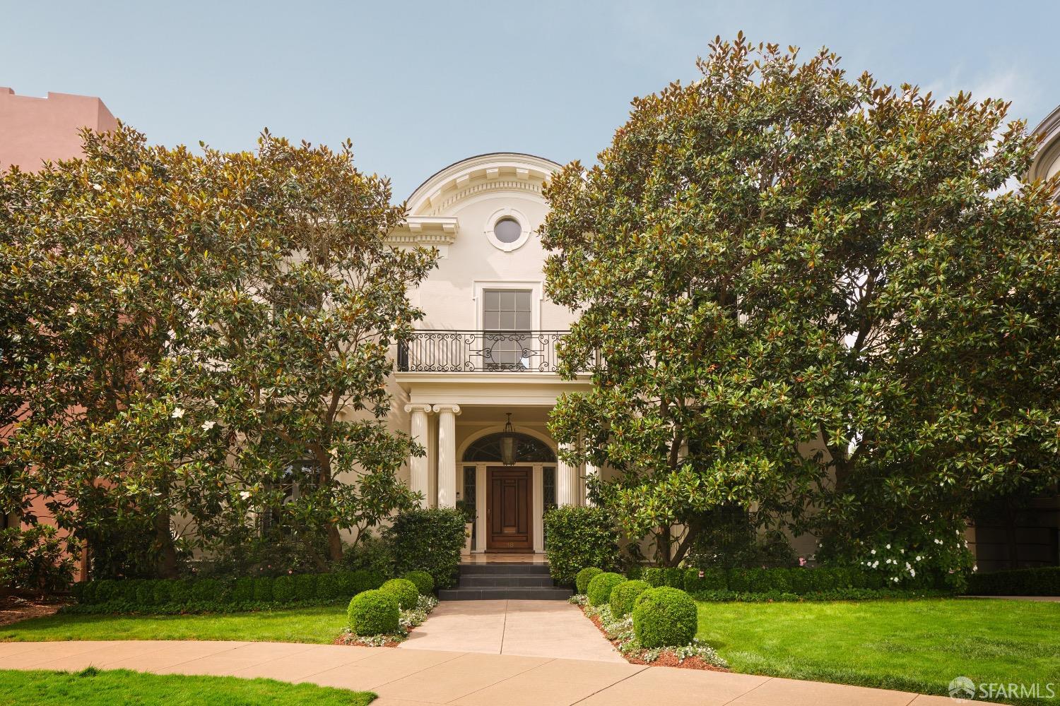 This dignified seven-bedroom residence stands stalwart on Presidio Terrace. Combining a chic contemporary aesthetic with classical style, it is filled with light and impressive in scale. Just inside are a handsome library, the formal living room, which features a central fireplace and French windows and doors, and the dining room that boasts a bay window admitting incredible natural light. Adjoining is a bright, open kitchen with an island, a Viking gas range, and walk-in pantries; and a breakfast bar that opens to an inviting family room with doors to a sun-washed terrace. One level above, the principal suite overlooks the gardens below and enjoys three closets, and a bath with a soaking tub and a shower. Three additional bedrooms each with ample closets complete the bedroom level. A gym, home office, guest suite, and a skylit family room occupy the top level. On the lower level, a private guest bedroom has multiple windows offering a flower-filled view of the backyard. Joining it are a media room, a wine cellar and tasting area, a laundry room, a full bath, and a generous oversized multi-car garage. An elevator connects three levels of the home. The vibrant backyard includes a lush expanse of lawn and a tranquil Japanese-inspired koi pond.