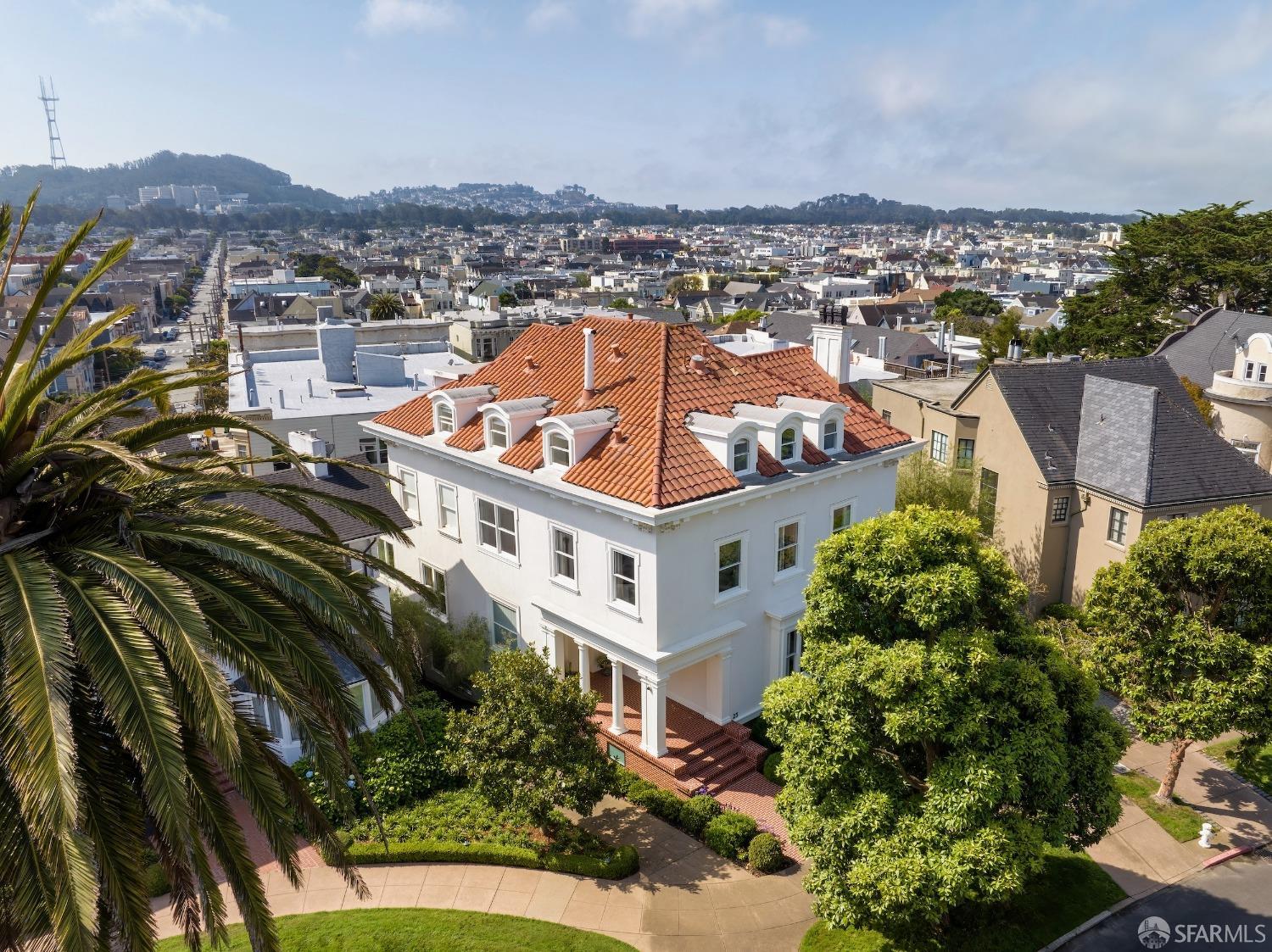 Past the iconic gates of Presidio Terrace, this classic 4-story Edwardian surprises with an elegant modern interior, blending functionality with exquisite finishes. Designed in 1910 by noted Bay Area architect Julius Krafft, the home was flawlessly reimagined & rebuilt in 2013, preserving the formal spaces for entertaining while expanding the footprint for elevated daily living. The home's main level offers a seamless entry hall, formal living room, formal dining w/ fireplace, library w/ balcony overlooking the yard, and open-concept kitchen w/ family lounge & dining. The second level is a sprawling primary suite w/ bed, bath, private terrace w/ hot tub, lounge, and dual offices (optional bedrooms). The third level includes 3 additional bedrooms & baths, plus bonus family room w/ sweeping southern city views. The lower garden level boasts a gym, steam/sauna room, guest suite, wine cellar, and media/rec room opening to the backyard w/ putting green, brick patio, mature bamboo, spiral staircase to upper level, and access to a 2+ car garage. Located in the sought-after yet rarely available enclave of Presidio Terrace w/ private security, well-maintained street & landscaping, and abundant parking, this meticulously finished home has everything needed for today's modern lifestyle.