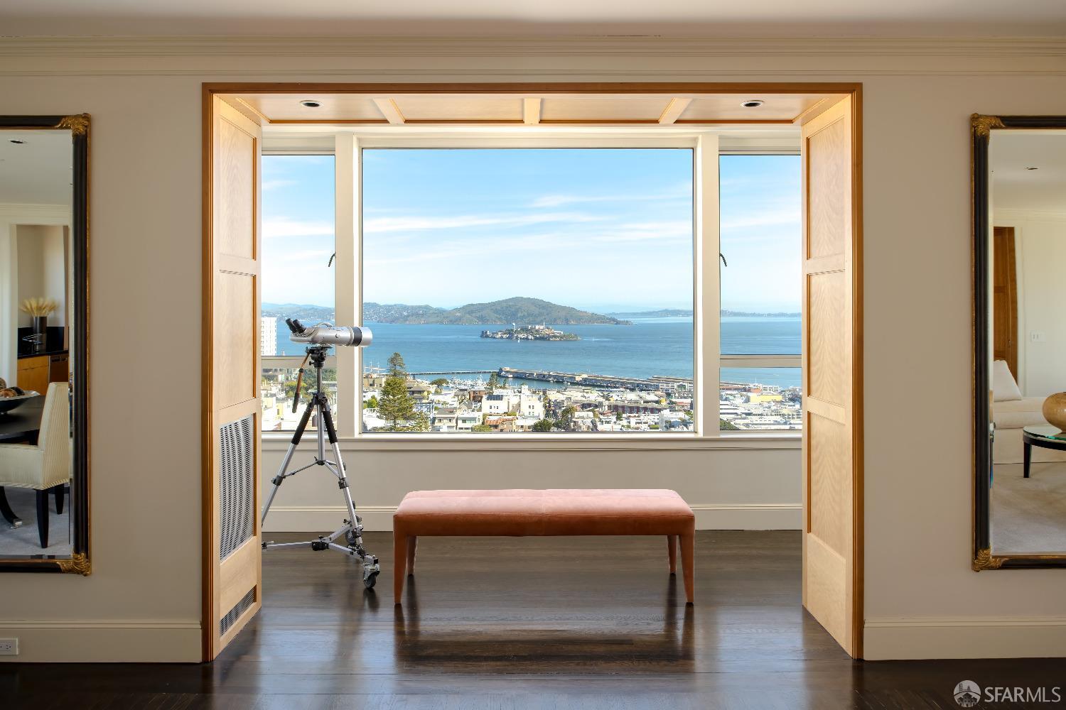 This distinguished co-op apartment is the only unit that encompasses an entire floor in this twelve-story circa 1929 building. The stately entrance, on a level block of Russian Hill, is staffed 24 hours and offers valet parking in addition to secure garage parking. With its full-floor design on the tenth floor, world-class picture postcard views wrap around the entire apartment from the towers of the Golden Gate Bridge to Alcatraz Island, Coit Tower, the entire Bay Bridge, and City skylines. Renovated from top to bottom with architecture by McEachron Architects, the interiors are masterfully appointed with designer style that begins from the moment of entry in the private elevator lobby. The foyer leads to the living and dining room combination which spans the width of the unit - perfect for entertaining.   Extending over approximately 5,300 square feet, this residence comprises 4 bedrooms with en suite baths plus 2 half-baths. A sizable library with Coit Tower views and hidden wet bar for entertaining rounds out the accommodations along with an oversized laundry room and significant storage throughout. Walk Score of 97, this home offers City convenience to Cable Car stops plus fine dining and cafes just blocks away, as well as George Sterling Park for recreation and tennis