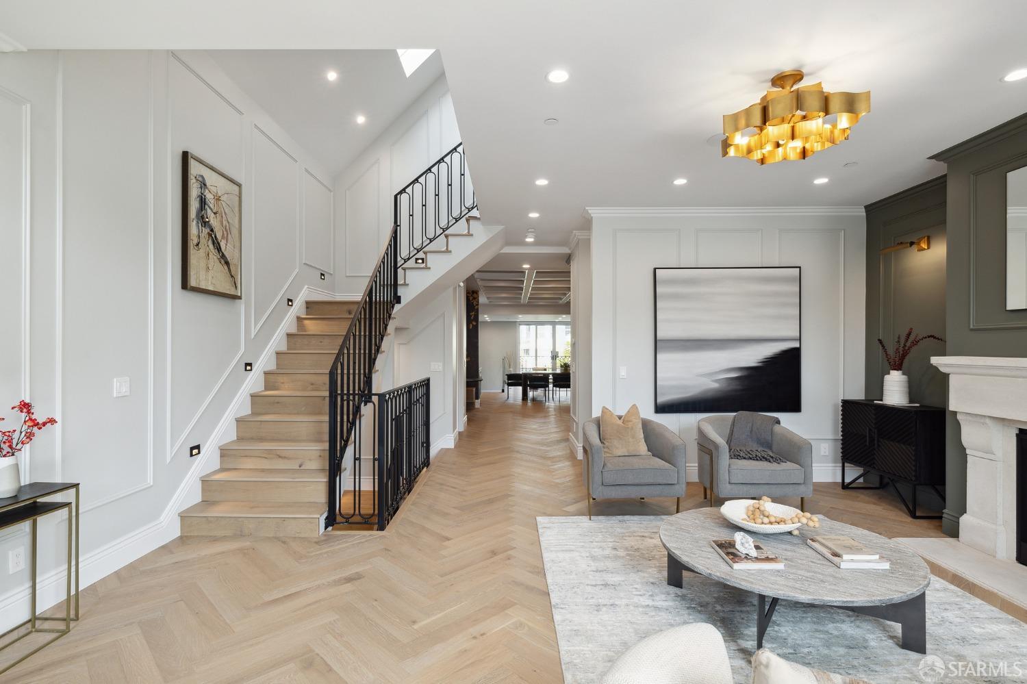 Step into modern elegance at 152 4th Avenue, a beautifully remodeled Victorian home in San Francisco's Lake Street neighborhood. This classic-meets-contemporary gem showcases fabulous entertaining spaces, feat. a LR w/ stone fireplace, white oak floors set in a striking herringbone pattern & high ceilings with skylights providing an airy and open ambiance. Well-appointed kitchen with a central island clad in Italian marble, a stunning Italian range, a butler's pantry and breakfast nook. The DR with its wet bar, and flows into the lounge area overlooking the yard. A tucked away powder room offers additional convenience for your guests. Upstairs, 3 well proportioned bedrooms & 2 baths, incl. a luxurious primary suite with sitting area, walk-in closet and terrace. The lower level offers a media room w/ wet bar & storage, 2 more bedrooms, one of them en-suite and 2 baths.The leveled backyard offers the perfect canvas for child play, gardening, and outdoor entertaining with a tiled patio area . A laundry room,1-car garage w/ EV charger, radiant floor heating, and built-in speakers add practicality to luxury living. New systems throughout incl. new plumbing, electrical, HVAC, sprinklers, foundation & roof. A+ location close to local restaurants & shops and minutes from the Presidio.