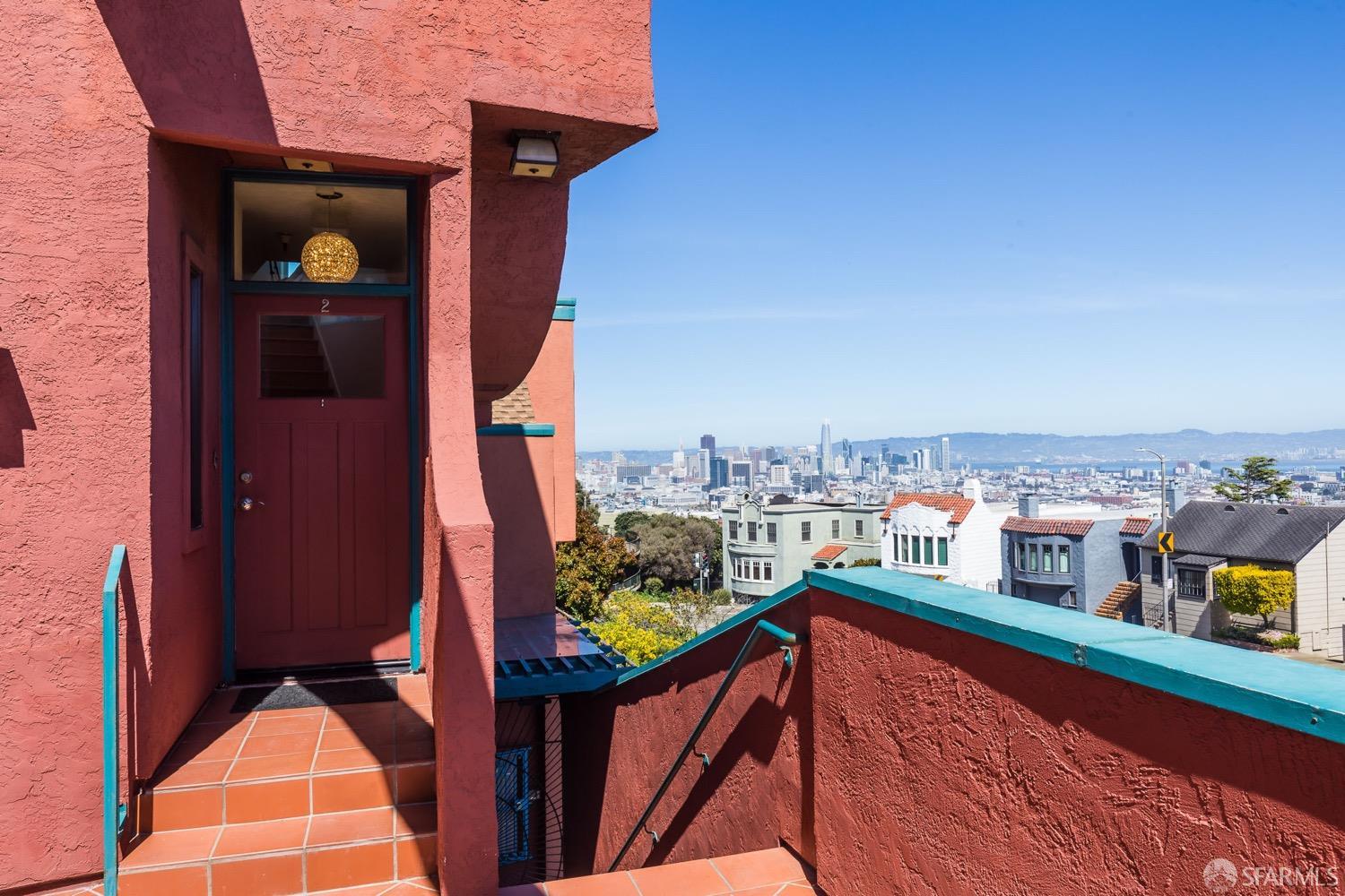 Gorgeous unobstructed views of the SF Skyline, from this rare townhouse-style condo (no one below you or above you) in a boutique 8 unit bldg, steps to Noe Valley, Eureka Valley, The Castro, Twin Peaks, Corona Heights and Buena Vista. This two bedroom two & one half bathroom residence boasts bamboo flooring, a cozy fireplace & double height ceilings in the living room, an oversized chef's kitchen with granite counters and bay window. This spectacular corner unit with extra windows and Northeast exposure gets flooded with natural light. In-unit laundry. Newer decks from 2021. Newer doors and custom windows. Swarovski crystal chandeliers in the entry & dining rooms. Newer furnace with AC for those hot SF summer days. Humidifier & whole house air filtration system, whole house fan (constant fully filtered air stream 24/7, filtering the air & constantly returning fresh filtered cleaned air), and blue light filter. Very well run HOA with many common area upgrades; newer courtyard tile, new exterior paint and lighting, new roofs, and newer automatic gas shut off values. Garage space is wide enough for 2 cars, plus storage, plus extra storage cabinets. But the real show stopper is the unobstructed view of the majestic San Francisco skyline right from the living room!