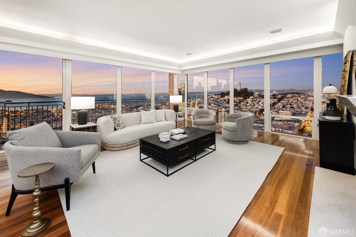 This rarely available apartment with 60-feet of northern windows at 1750 Taylor captivates with sweeping views of Alcatraz, Coit Tower, Bay Bridge, and the downtown San Francisco skyline.  Encounter a custom layout featuring a living room, library and wet bar, dining area, and a two-sided fireplace - creating versatility for many styles of use.  The oversized primary bedroom is outfitted with ample closets and a two-chambered bathroom. The guest bedroom includes a bathroom and shower with a Bay view. Infrastructure enhancements include power shades and sophisticated overhead and cove lighting. And those views! Built in 1964 and known as The Royal Towers, 1750 Taylor is Northside San Francisco's most highly amenitized address.  Residents enjoy a custom fitness center and a glass-housed, heated swimming pool with a retractable roof.  Its majestic owner's club room with soaring ceilings and landmark views, library, conference room & lobby were all recently redesigned by internationally renowned design firm ODADA.  A 24/7 attended lobby, large and attentive staff, and professional on-site management ensure one's time in San Francisco is effortless and enjoyable.
