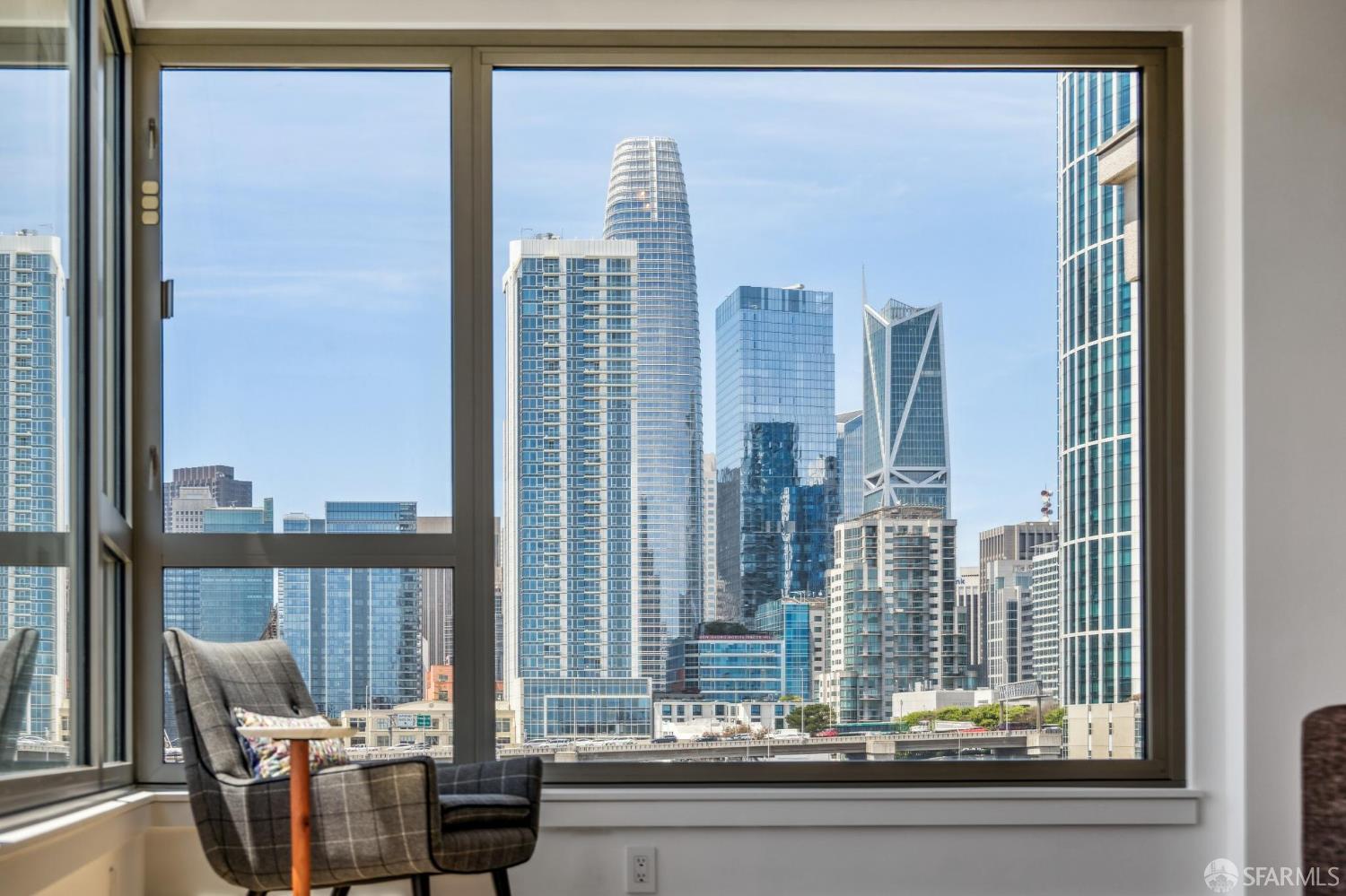229 Brannan San Francisco, California Located 1 block from the Embarcadero Waterfront, this corner unit offers an extensive sunlight throughout the day, two bedrooms, two full baths and Twin Peaks and SF skyline views. Unit 11J is highlighted by an expansive and elegant L shaped living and dining rooms complemented by a spacious lounge and reading area. A large primary bedroom with en suite bathroom includes a private balcony with Twin Peaks views, while the expansive windows in the second bedroom provide far-reaching and dramatic city views. Situated on opposite sides of the unit, the two bedrooms provide an unparalleled level of privacy. The Brannan is a full-service building offering 24-hr security, concierge services, professionally managed, amazing pool, jacuzzi and fitness center.